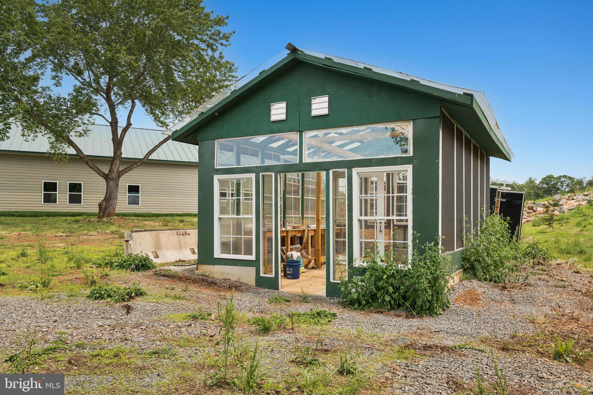 7285 Opal Road Warrenton, VA 20186 - Photo 27 of 34 a front view of a house with garden