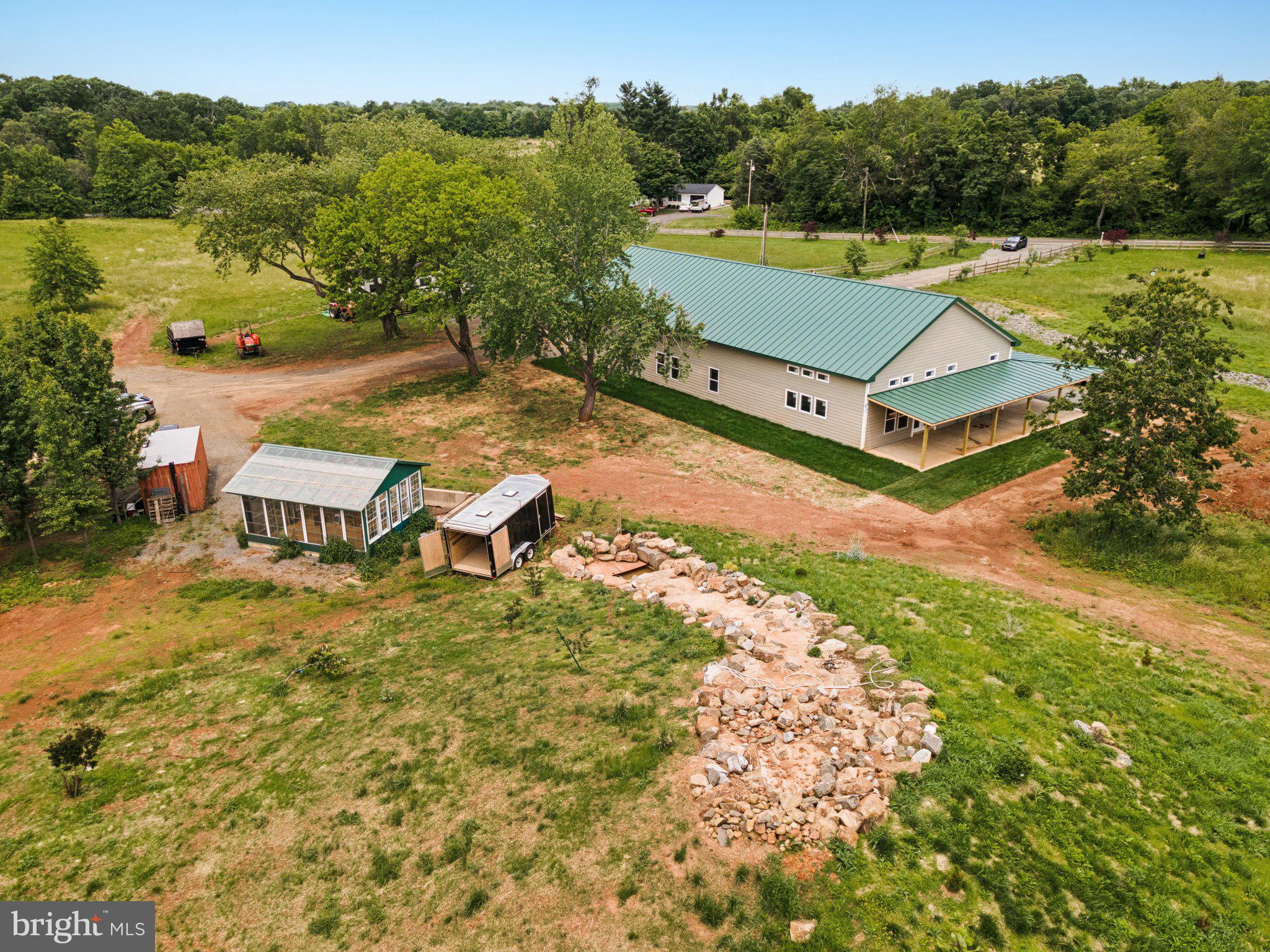 7285 Opal Road Warrenton, VA 20186 - Photo 3 of 34 an aerial view of a house with pool