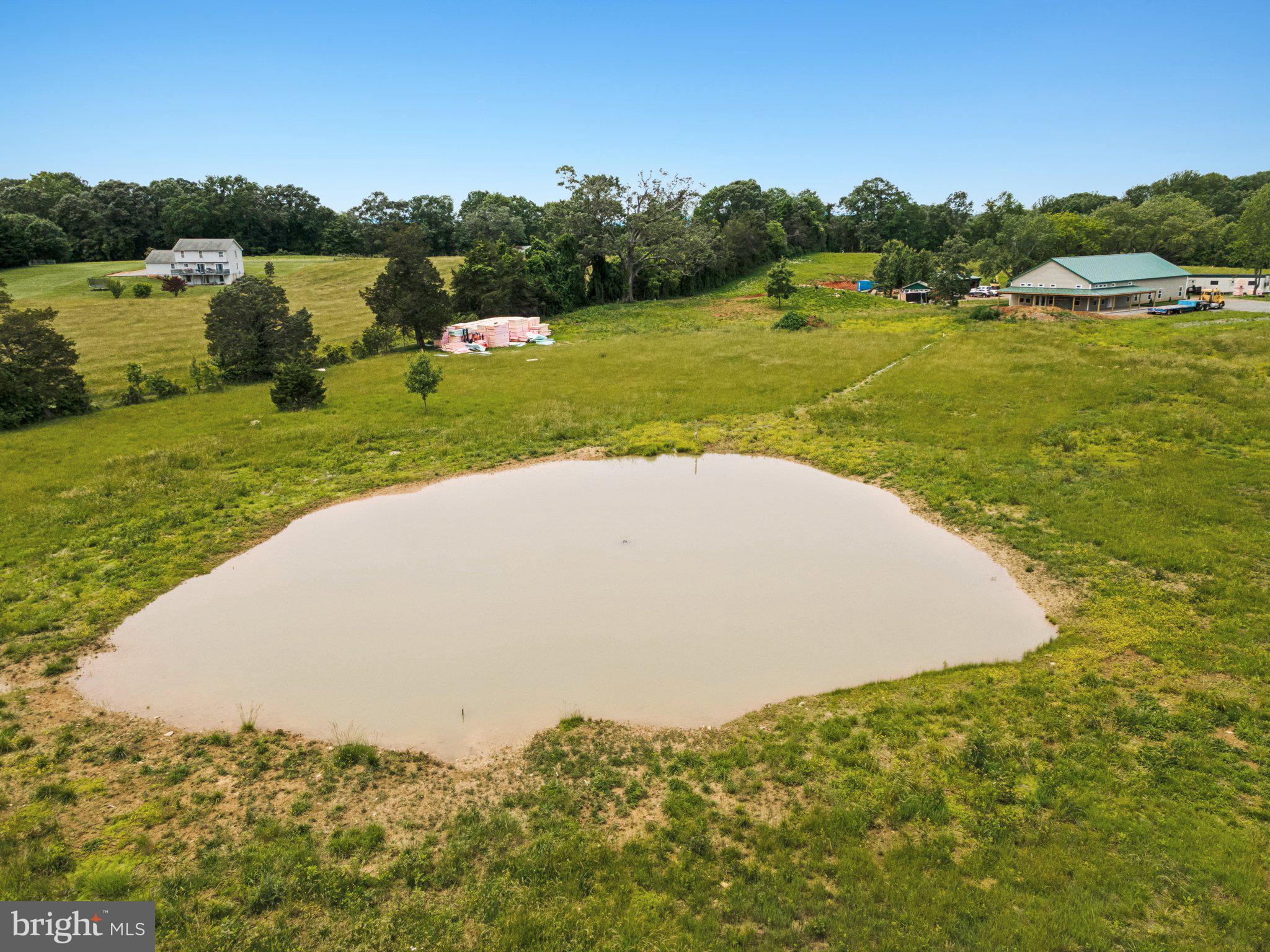 7285 Opal Road Warrenton, VA 20186 - Photo 31 of 34 a view of a lake with a yard