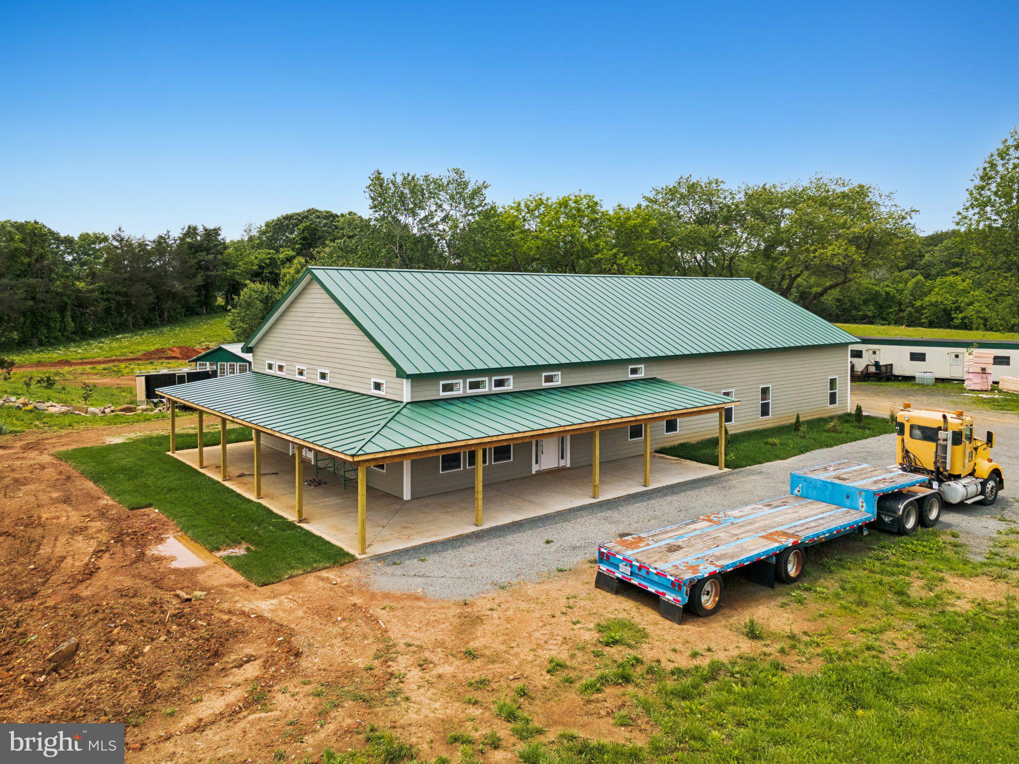 7285 Opal Road Warrenton, VA 20186 - Photo 5 of 34 a view of a house with pool and chairs
