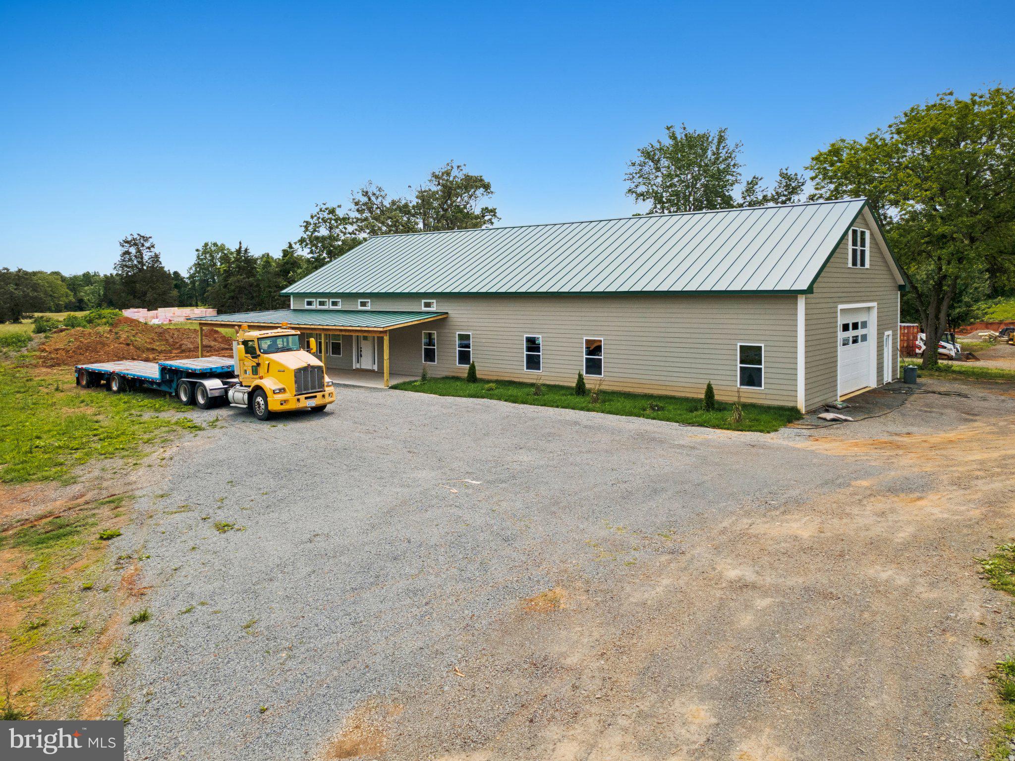 7285 Opal Road Warrenton, VA 20186 - Photo 6 of 34 a view of garage with parked cars