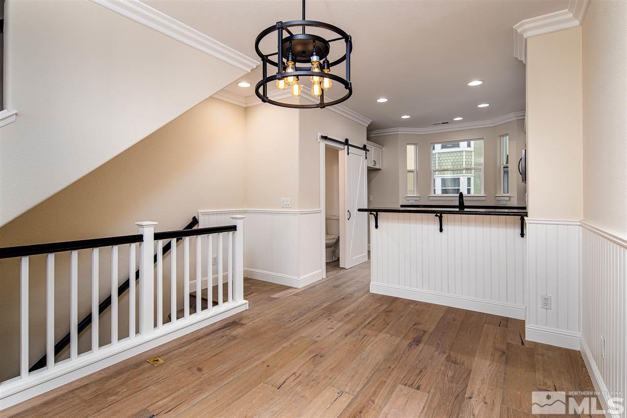 260 Gramercy Lane Reno, NV 89509 - Photo 4 of 25 a view of a room with wooden floor and chandelier