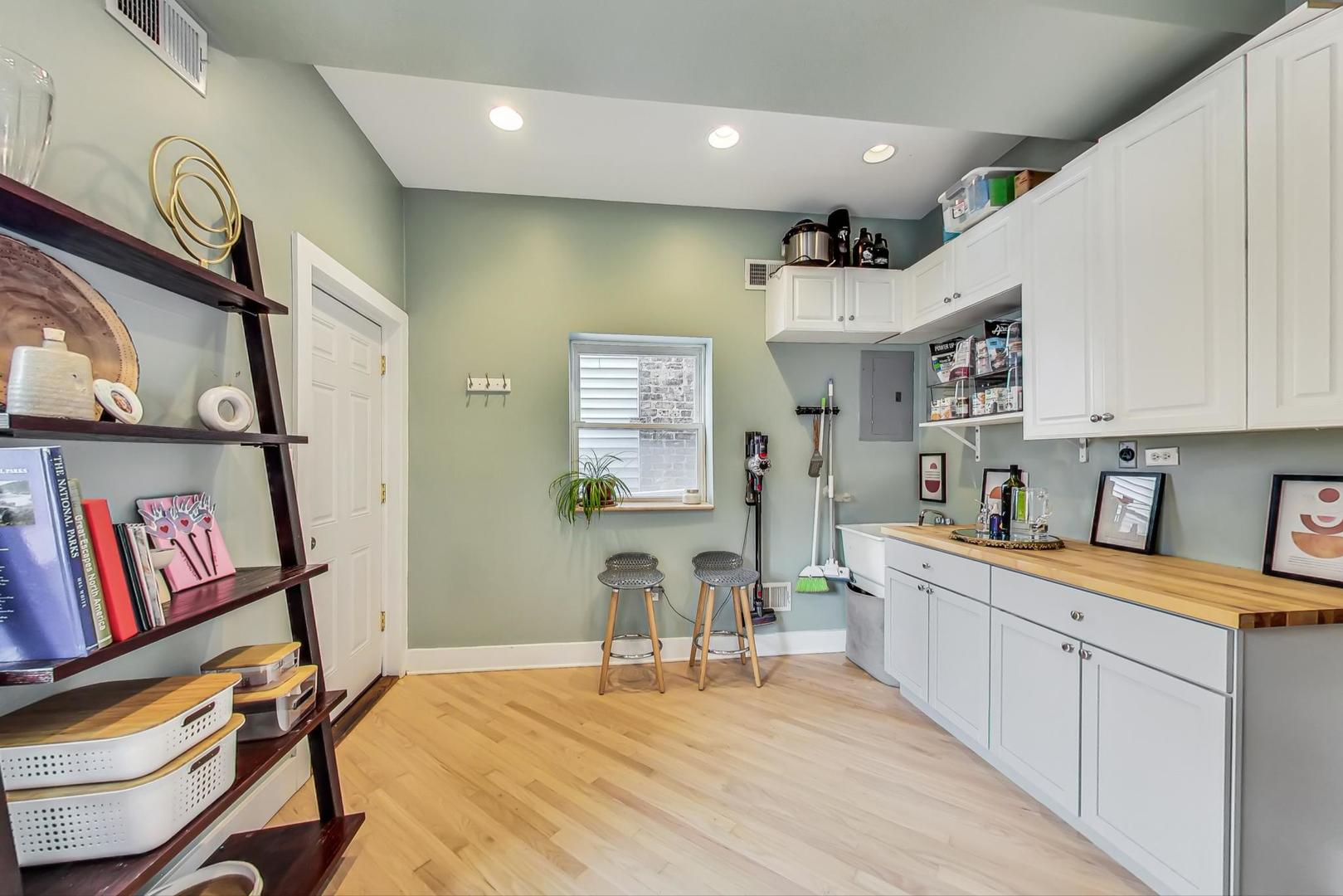 2320 West Belden Avenue Chicago, IL 60647 - Photo 17 of 36 a room with stainless steel appliances lots of wooden furniture