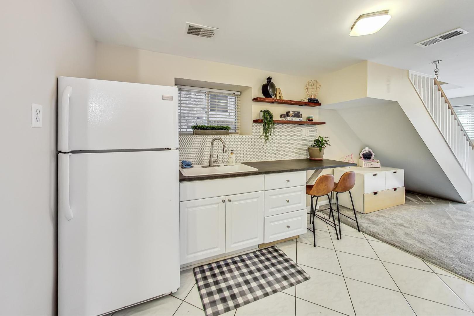 2320 West Belden Avenue Chicago, IL 60647 - Photo 20 of 36 a kitchen with stainless steel appliances a refrigerator sink and cabinets