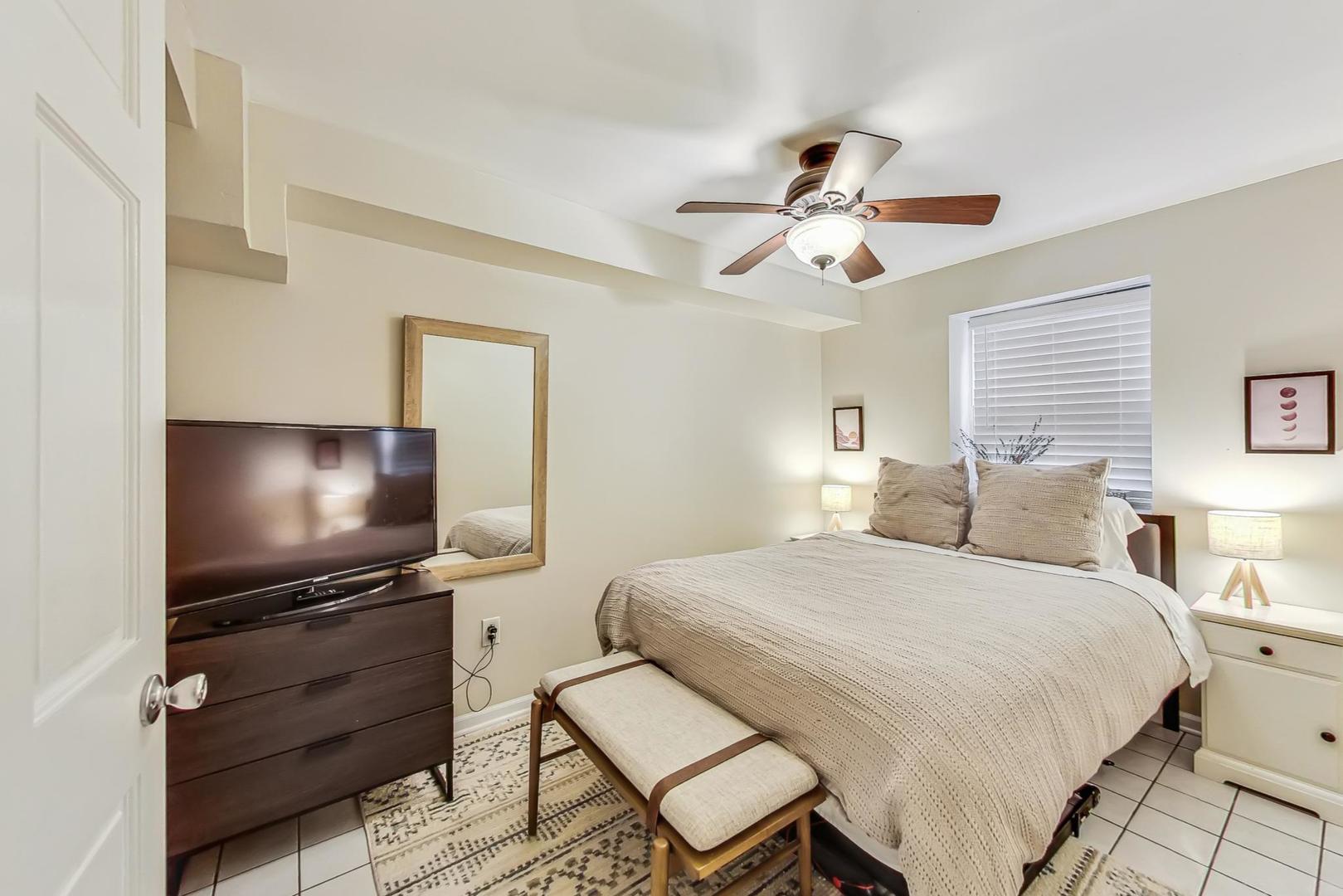 2320 West Belden Avenue Chicago, IL 60647 - Photo 22 of 36 a bedroom with a bed and a flat screen tv