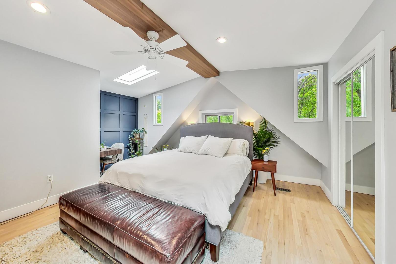 2320 West Belden Avenue Chicago, IL 60647 - Photo 7 of 36 a bed room with a bed and a potted plant