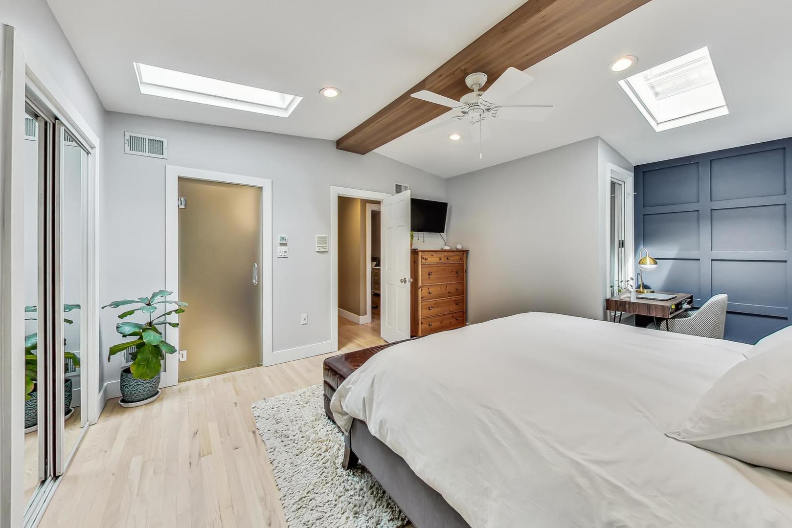 2320 West Belden Avenue Chicago, IL 60647 - Photo 8 of 36 a bedroom with a bed and a chandelier