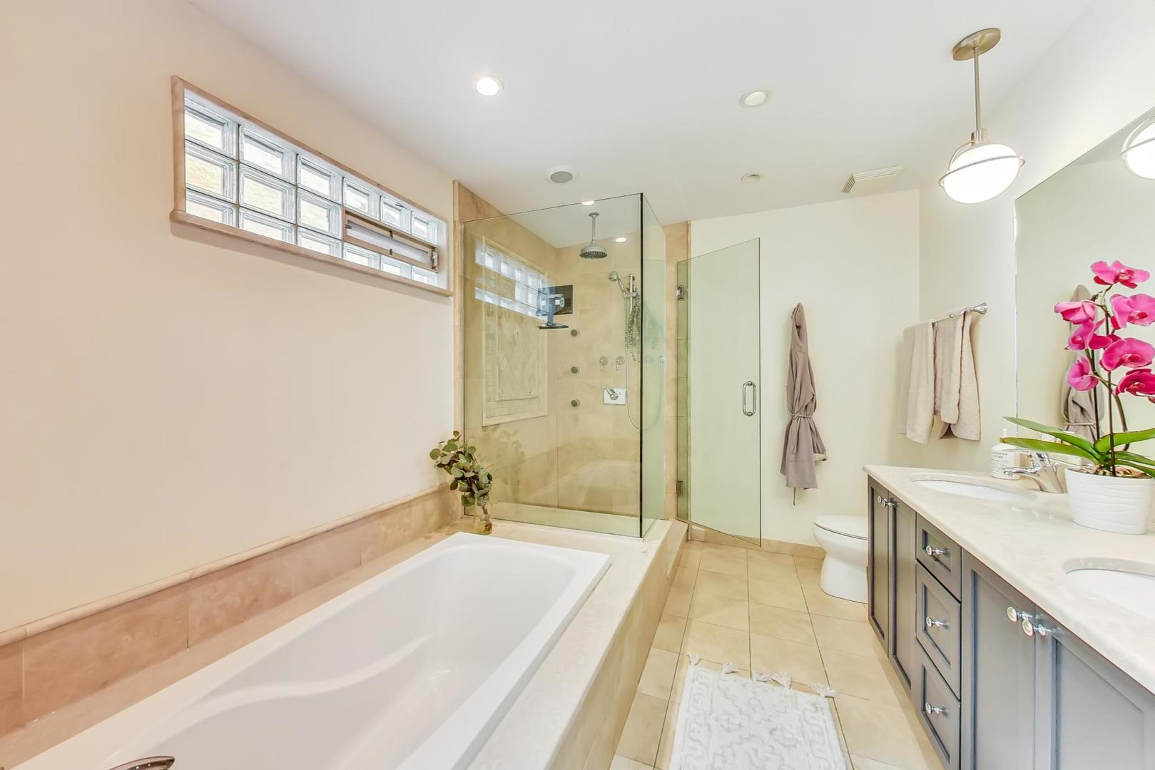 2320 West Belden Avenue Chicago, IL 60647 - Photo 9 of 36 a spacious bathroom with a tub sink and shower