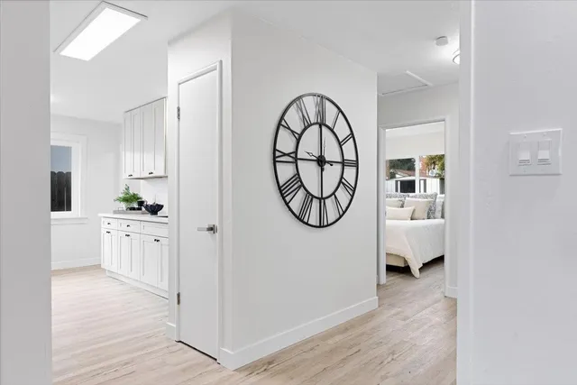 a view of a hallway with washer and dryer