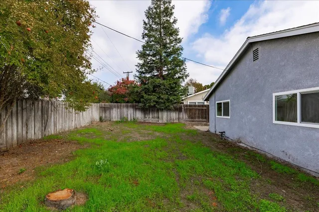 a backyard of a house with lots of green space
