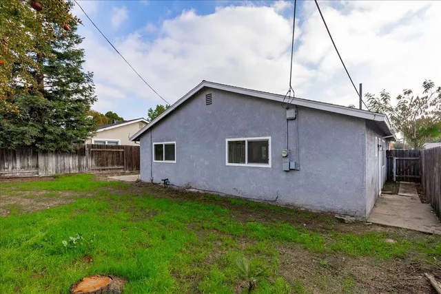 a backyard of a house with lots of green space