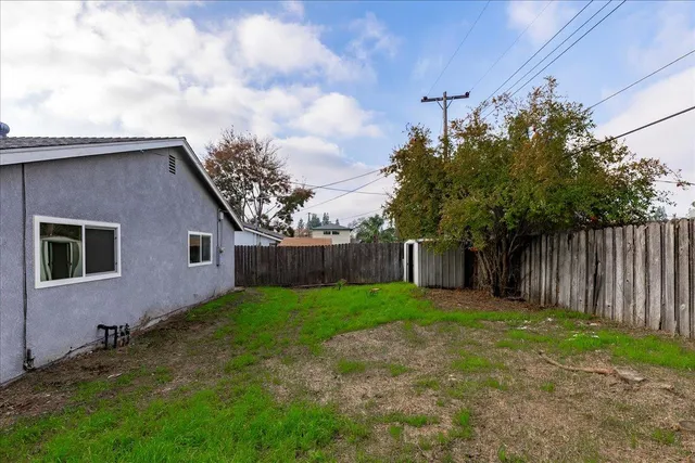 a backyard of a house with lots of green space