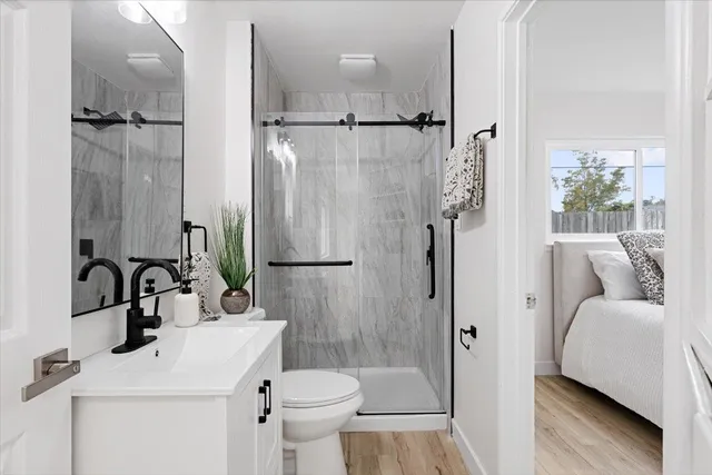 a bathroom with a sink toilet and shower