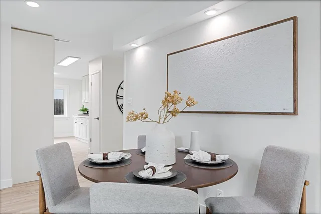 a table room with furniture and wooden floor