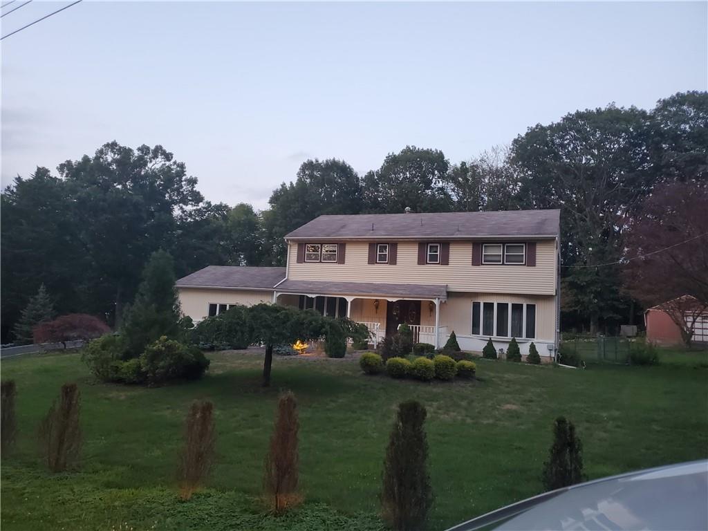 4 Deerwood Road Spring Valley, NY 10977 - Photo 1 of 1 a front view of a house with a garden