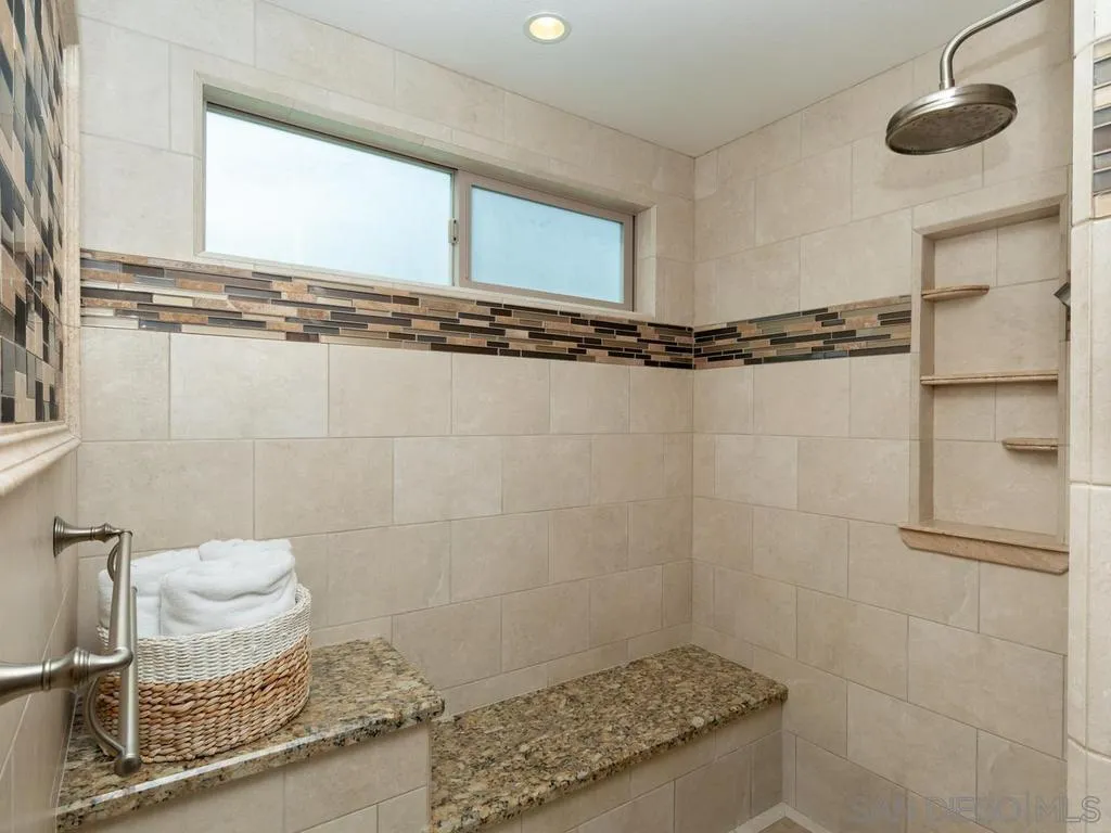 1981 Avenida Joaquin Encinitas, CA 92024 - Photo 29 of 51 a bathroom with a granite countertop sink a mirror and a shower