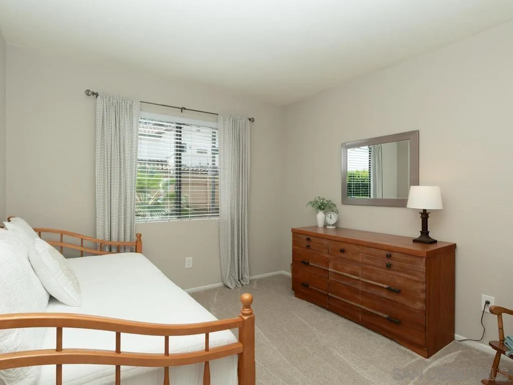 1981 Avenida Joaquin Encinitas, CA 92024 - Photo 31 of 51 a bedroom with a bed and a dresser in it