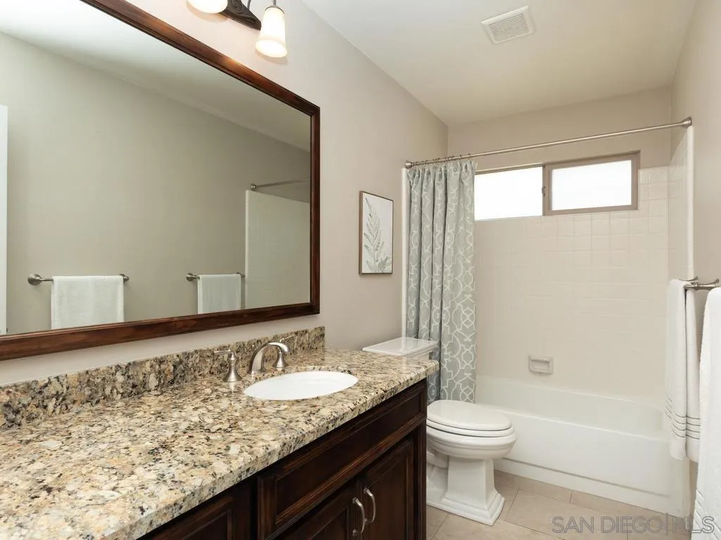 1981 Avenida Joaquin Encinitas, CA 92024 - Photo 35 of 51 a bathroom with a granite countertop sink toilet and shower