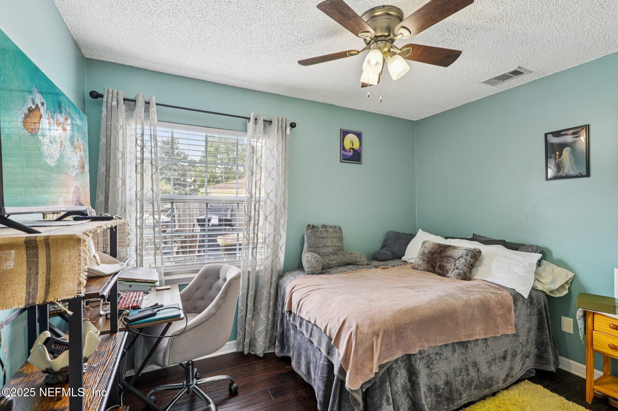 8053 Queensferry Lane Jacksonville, FL 32244 - Photo 23 of 45 a bedroom with a bed and a desk