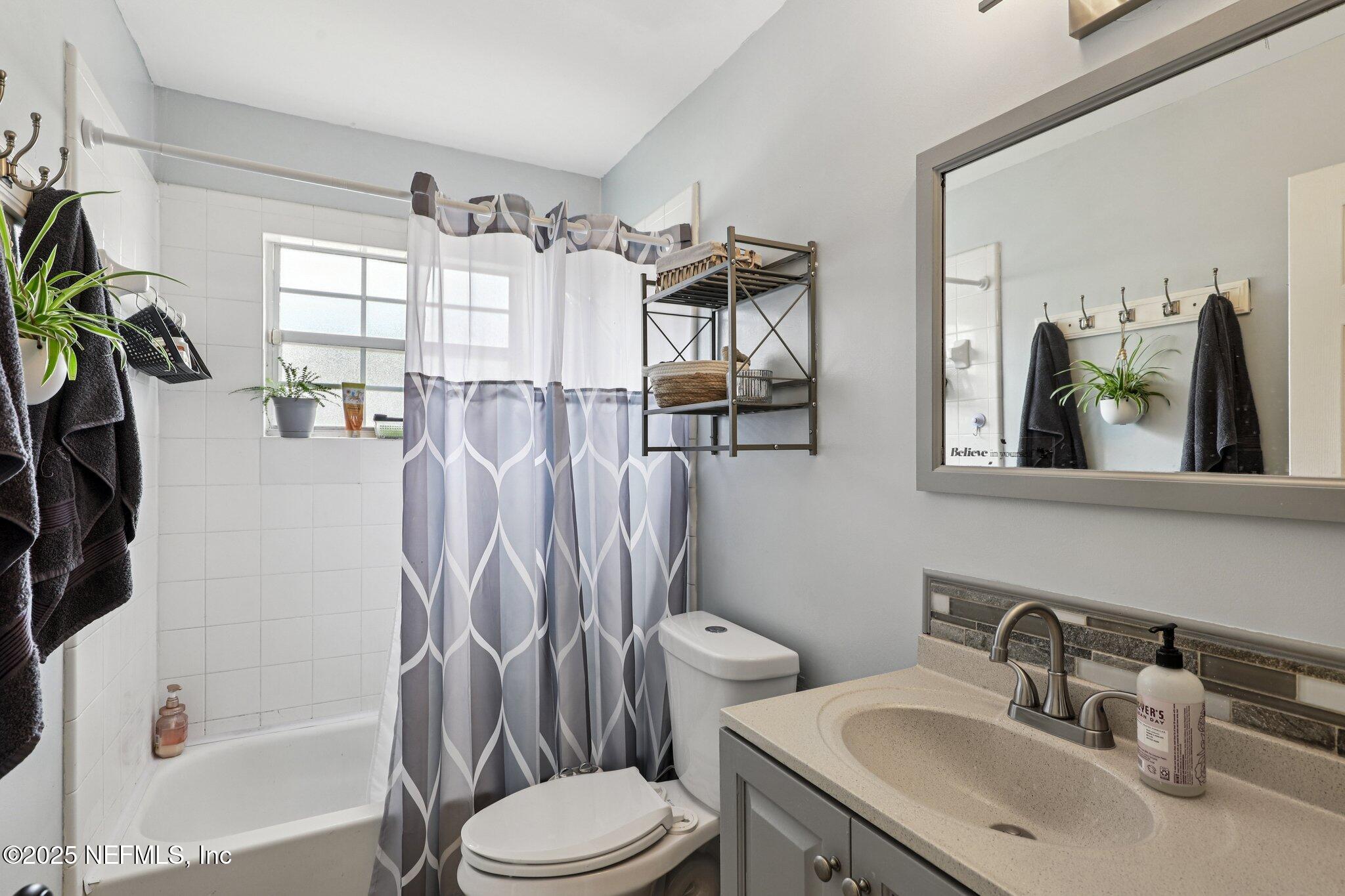 8053 Queensferry Lane Jacksonville, FL 32244 - Photo 25 of 45 a bathroom with a sink toilet and shower