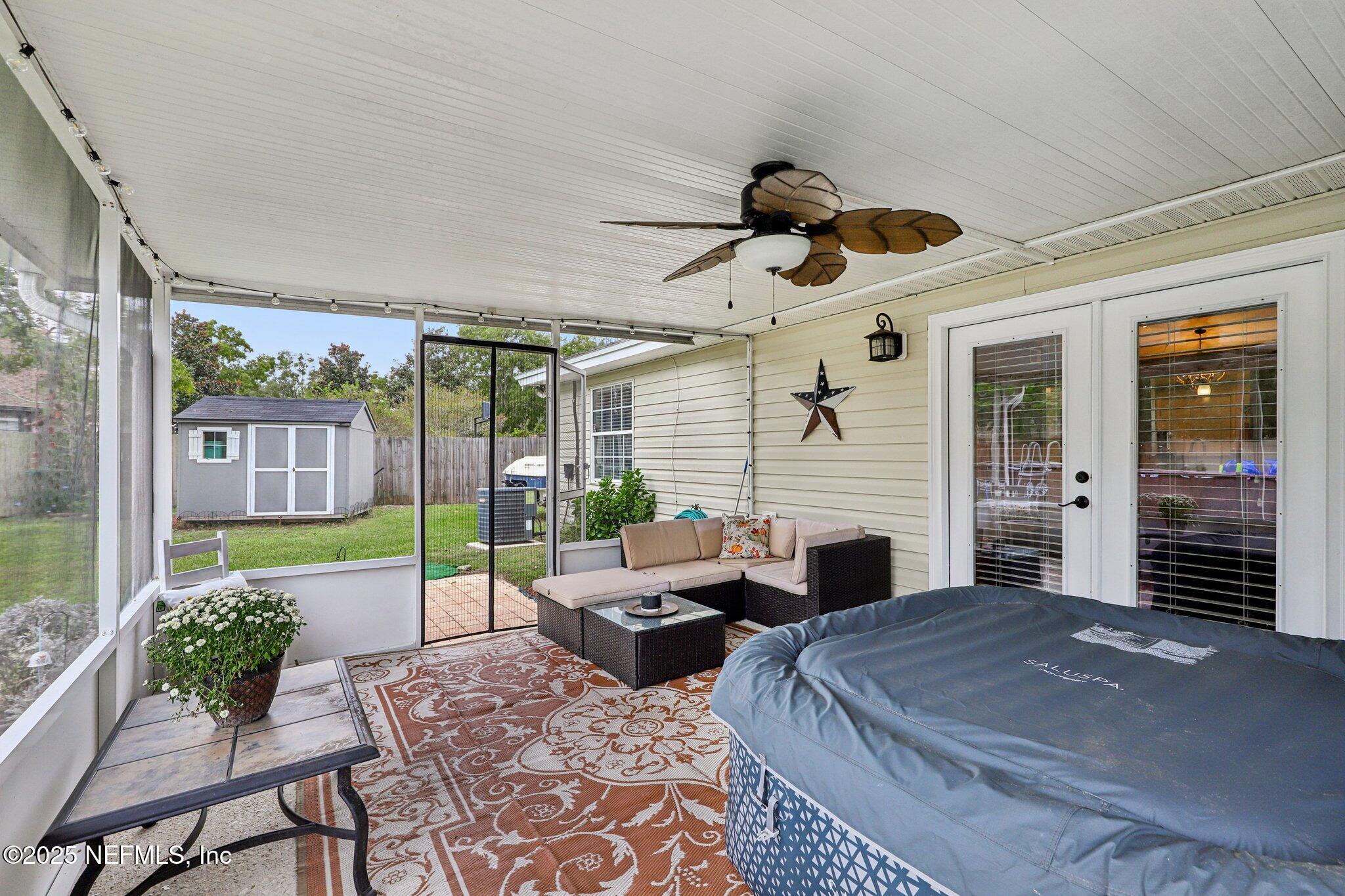 8053 Queensferry Lane Jacksonville, FL 32244 - Photo 29 of 45 a bedroom with furniture and a large window