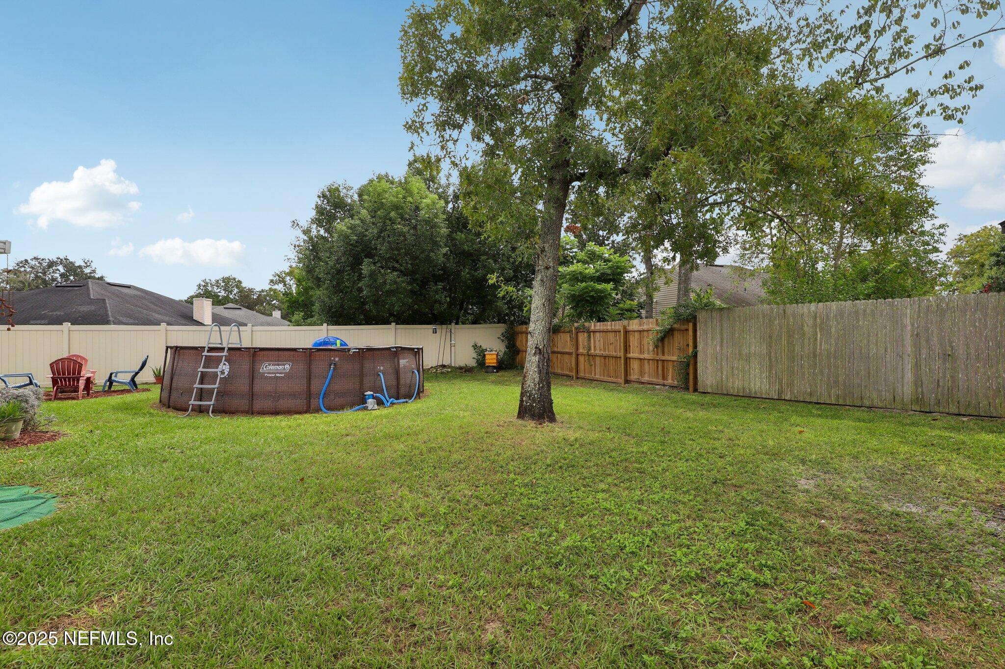 8053 Queensferry Lane Jacksonville, FL 32244 - Photo 30 of 45 a view of a house with a yard and a tree