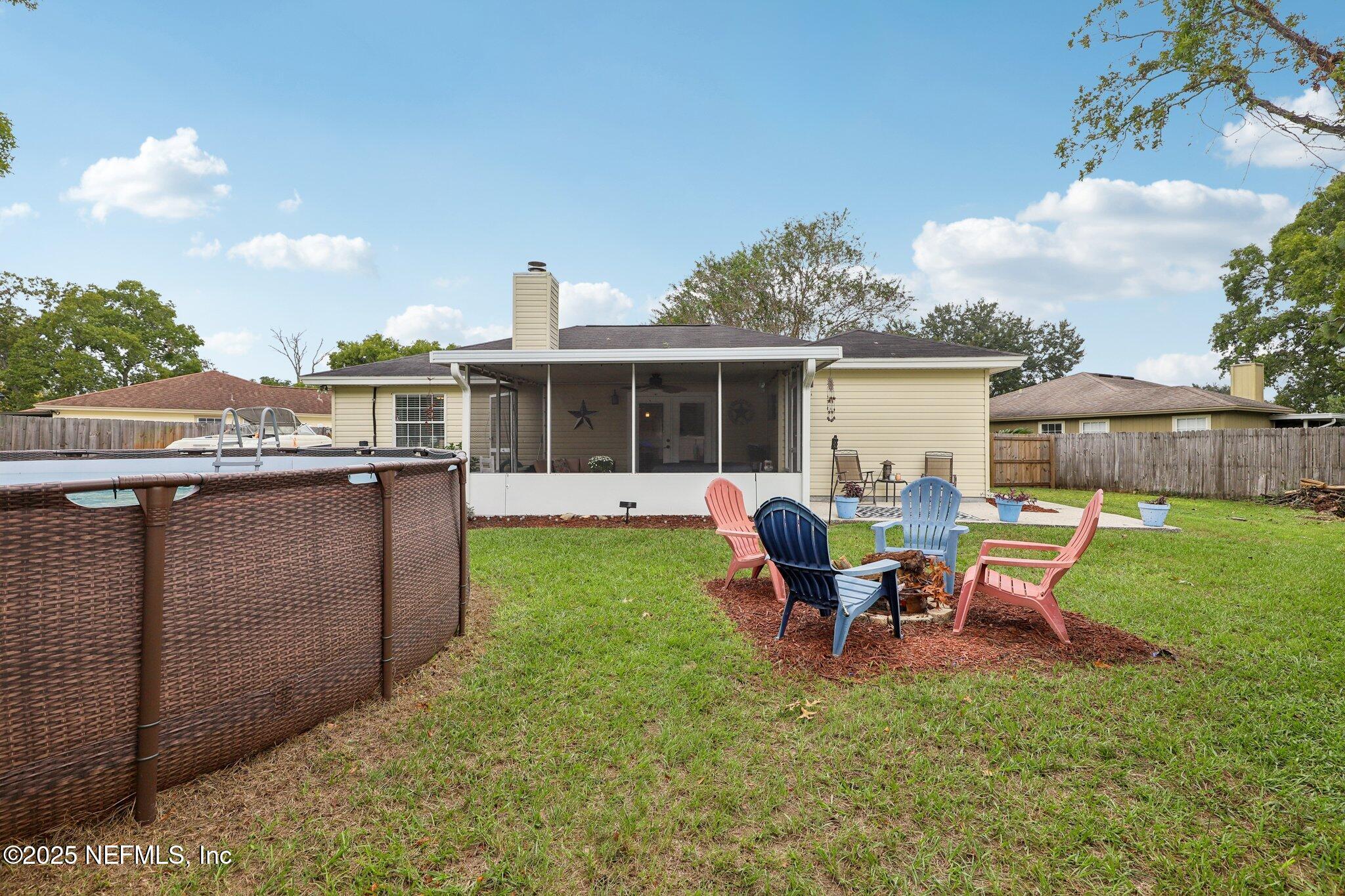8053 Queensferry Lane Jacksonville, FL 32244 - Photo 33 of 45 a view of a house with backyard sitting area and garden