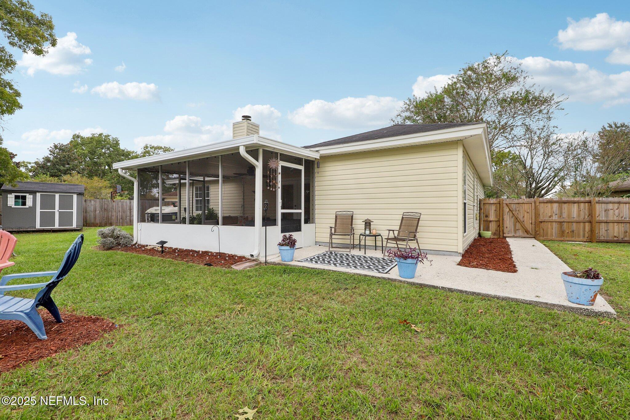 8053 Queensferry Lane Jacksonville, FL 32244 - Photo 34 of 45 a view of house with a backyard porch and sitting area
