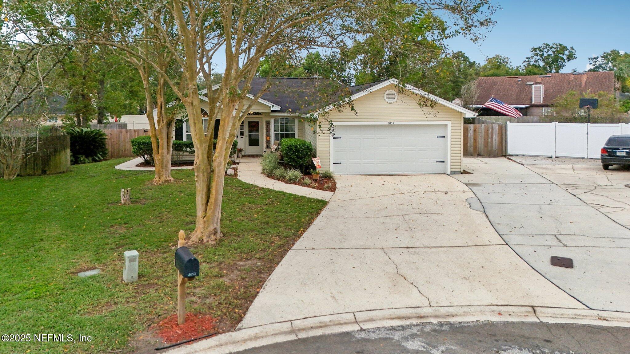8053 Queensferry Lane Jacksonville, FL 32244 - Photo 35 of 45 a front view of a house with a yard and garage