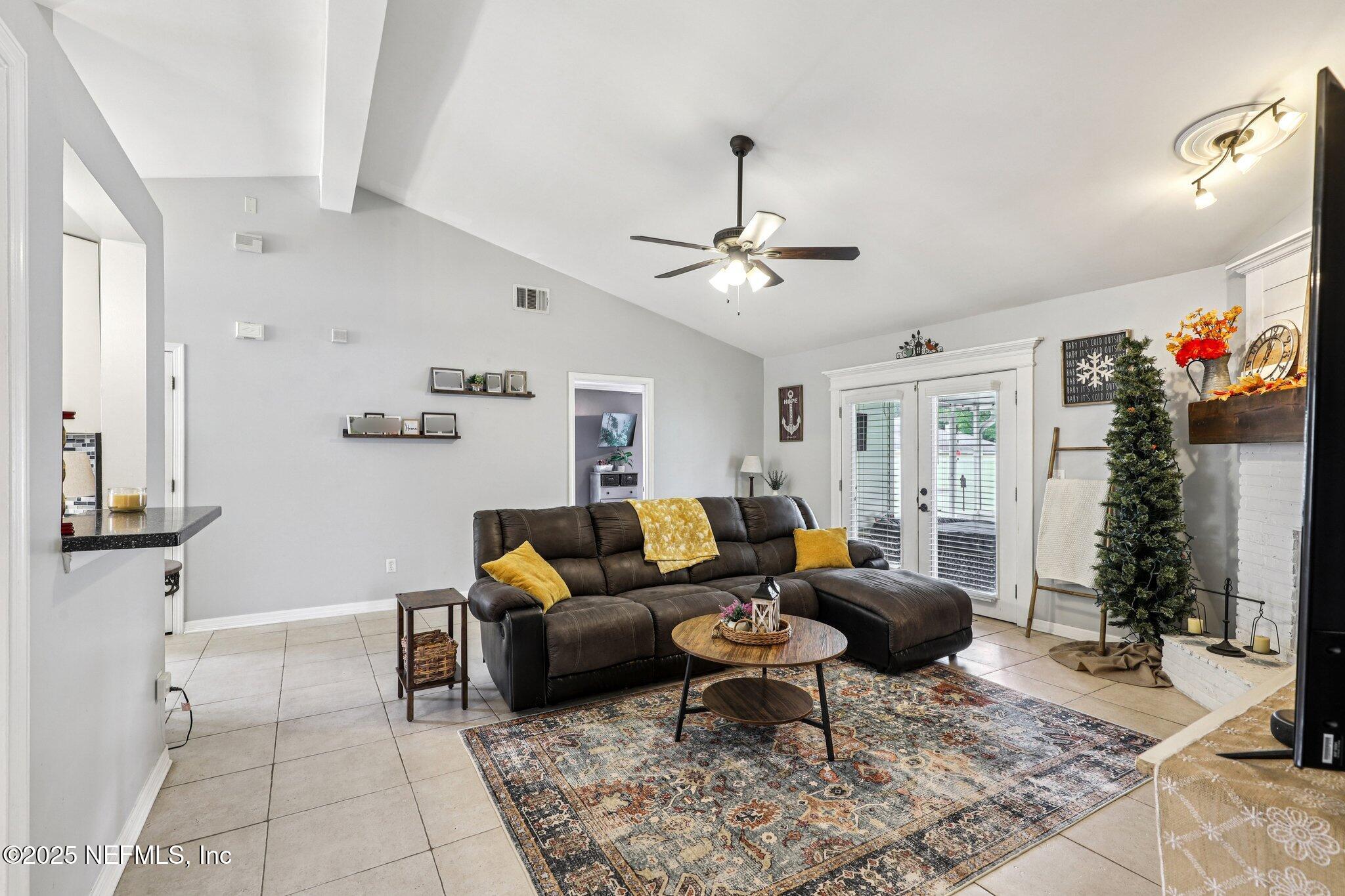 8053 Queensferry Lane Jacksonville, FL 32244 - Photo 6 of 45 a living room with furniture a dining table and a potted plant