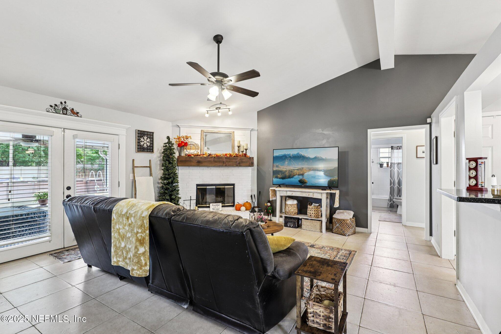 8053 Queensferry Lane Jacksonville, FL 32244 - Photo 7 of 45 a living room with fireplace furniture and a flat screen tv