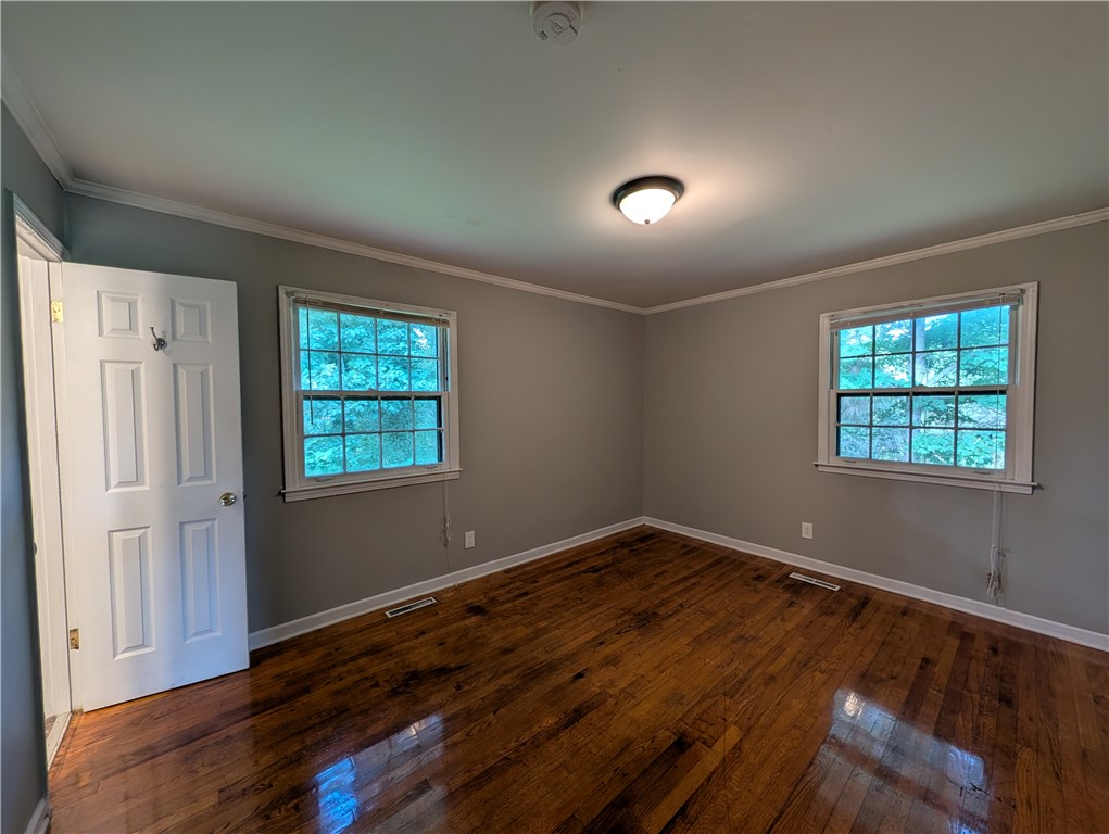 203 Glendale Road Anderson, SC 29624 - Photo 15 of 20 Hardwood flooring extends throughout this versatile room, offering warm tones and durability.