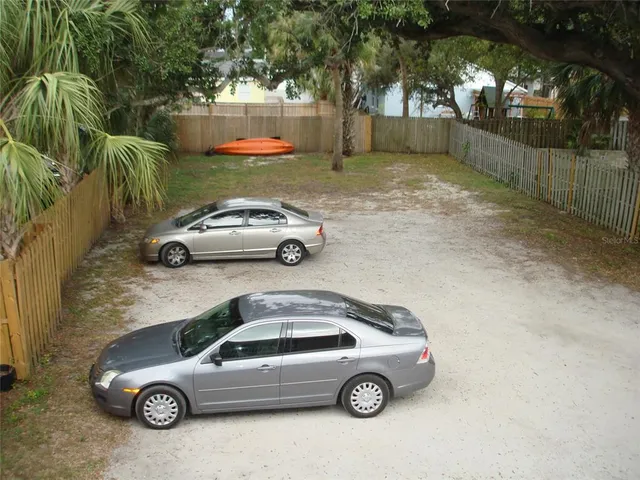 a view of a car parked in a yard