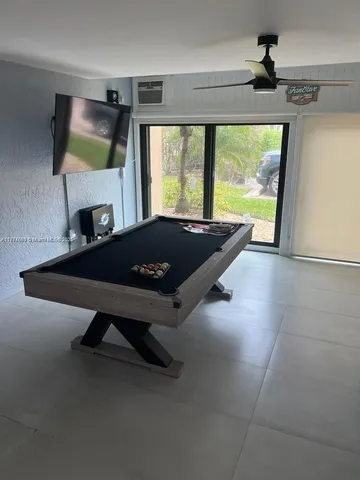 a room with a bed and a large window