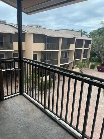 a balcony view with an outdoor space