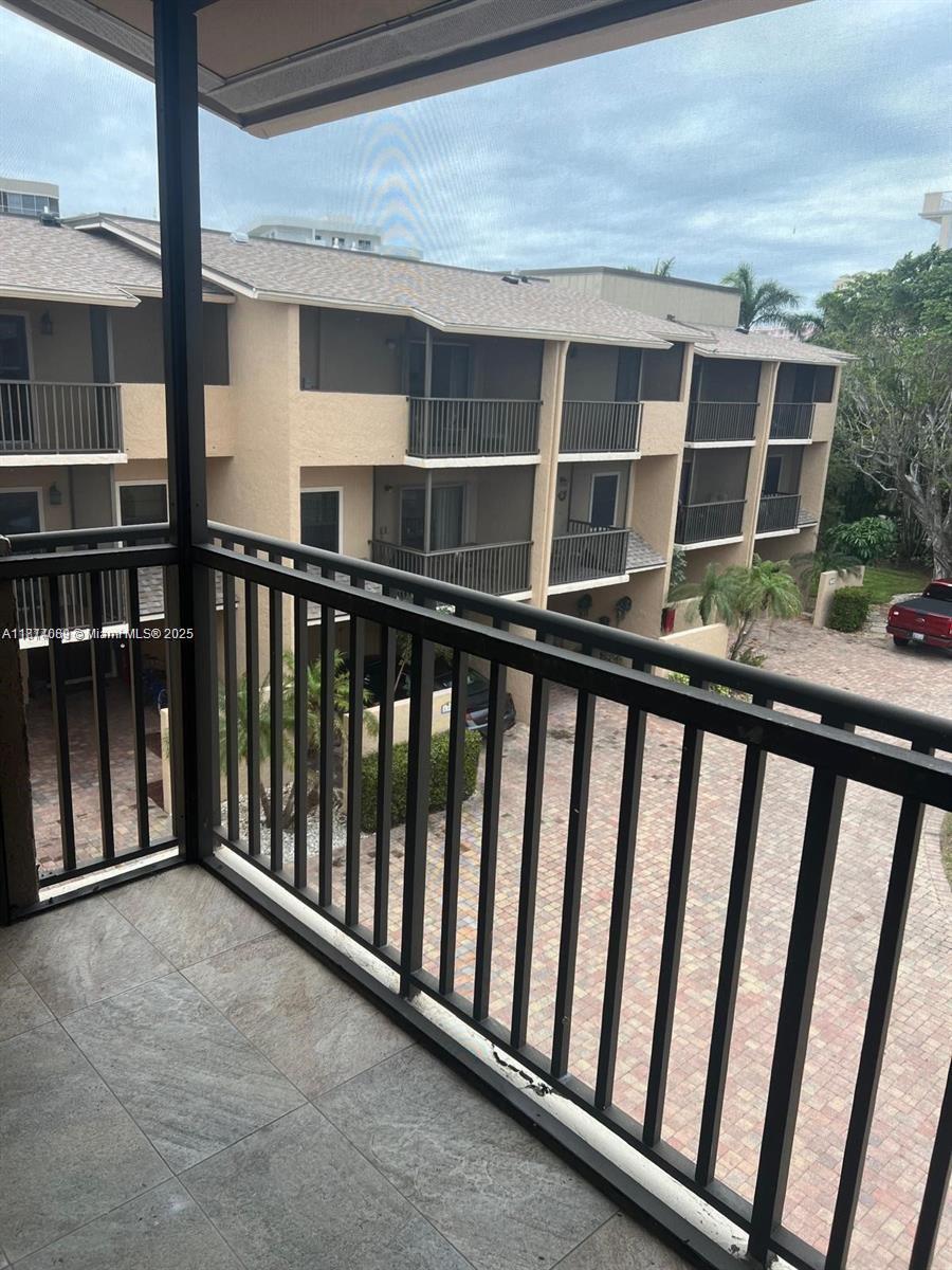 1103 South Collier Boulevard, Unit C108 Marco Island, FL 34145 - Photo 23 of 34 a balcony view with an outdoor space