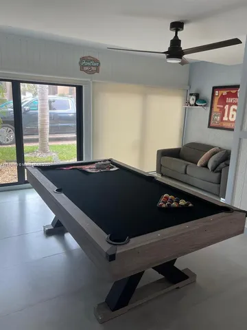 a bed sitting in a room next to a window