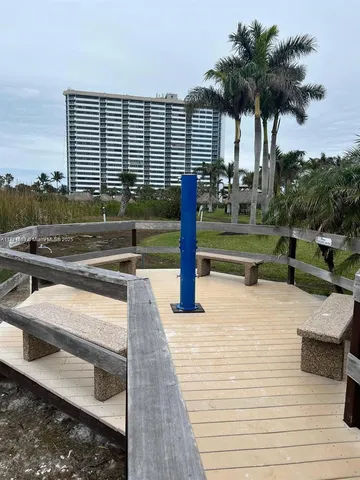 a view of a swimming pool with a deck