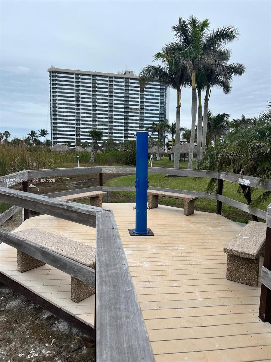 1103 South Collier Boulevard, Unit C108 Marco Island, FL 34145 - Photo 29 of 34 a view of a swimming pool with a deck