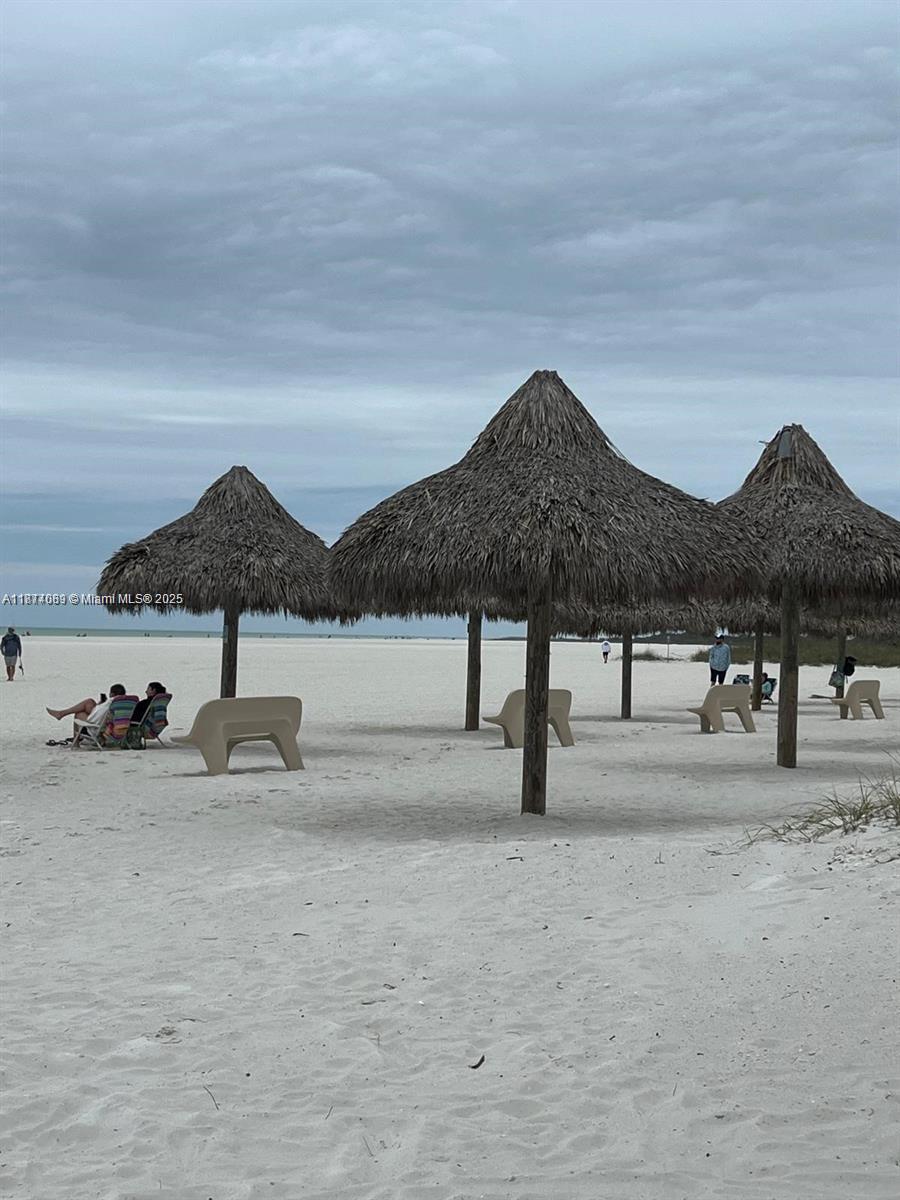 1103 South Collier Boulevard, Unit C108 Marco Island, FL 34145 - Photo 30 of 34 a front view of a house with yard