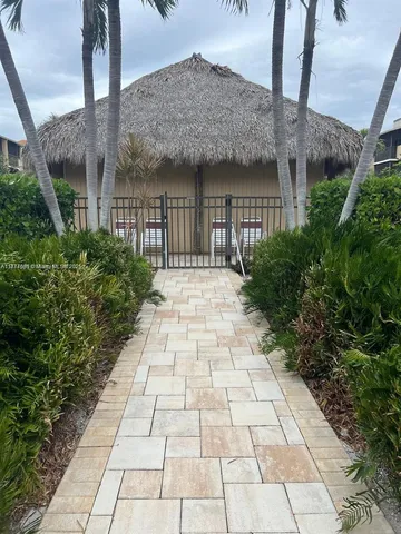 a view of a pathway with a yard