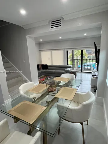 a view of a dining room with furniture