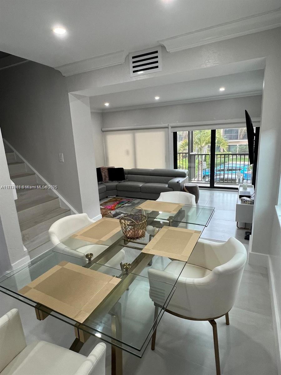 1103 South Collier Boulevard, Unit C108 Marco Island, FL 34145 - Photo 8 of 34 a view of a dining room with furniture
