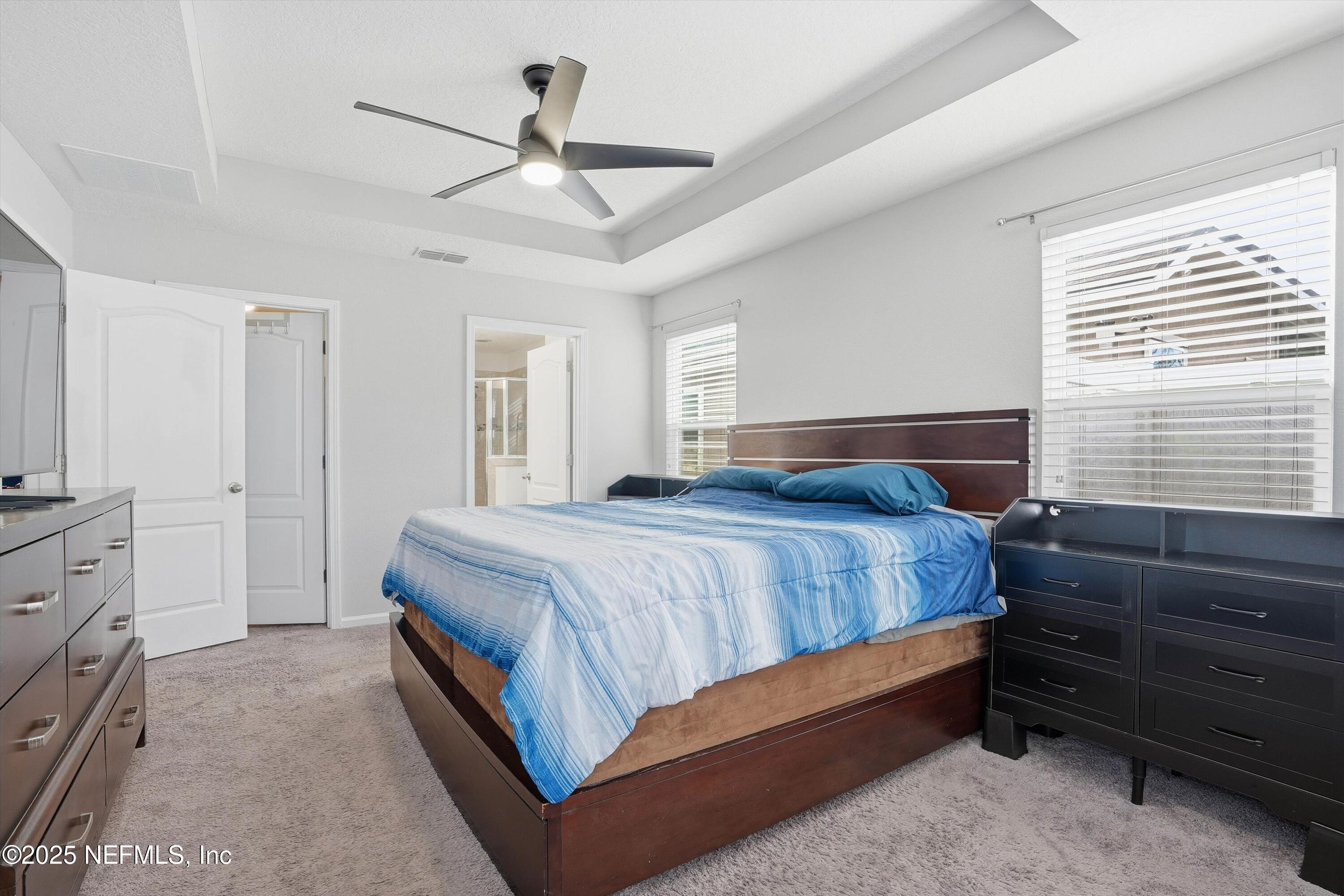 3994 Great Falls Loop Middleburg, FL 32068 - Photo 11 of 30 a bedroom with a bed and a dresser
