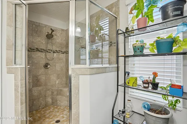 a bathroom with a sink and a shower