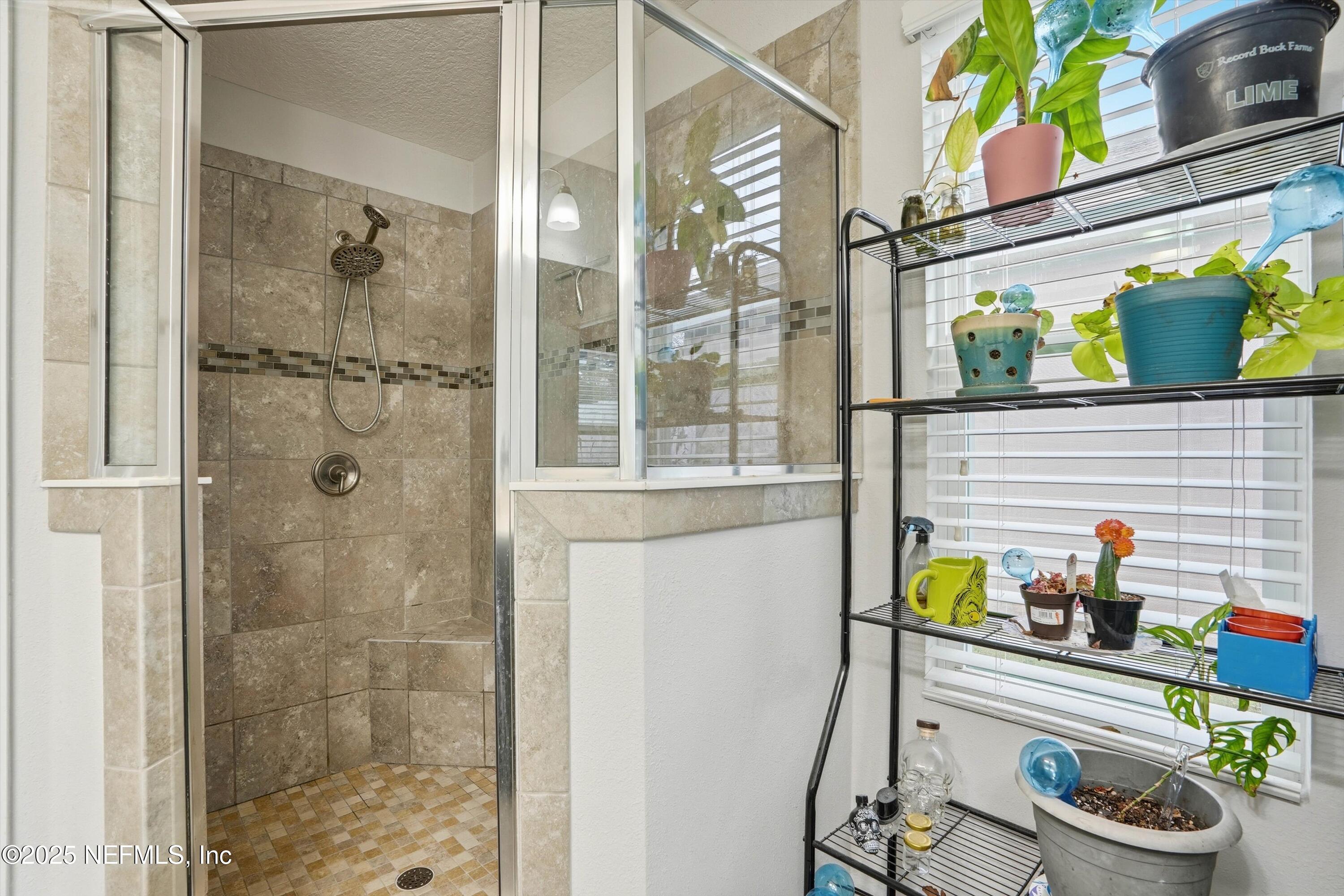 3994 Great Falls Loop Middleburg, FL 32068 - Photo 13 of 30 a bathroom with a sink and a shower