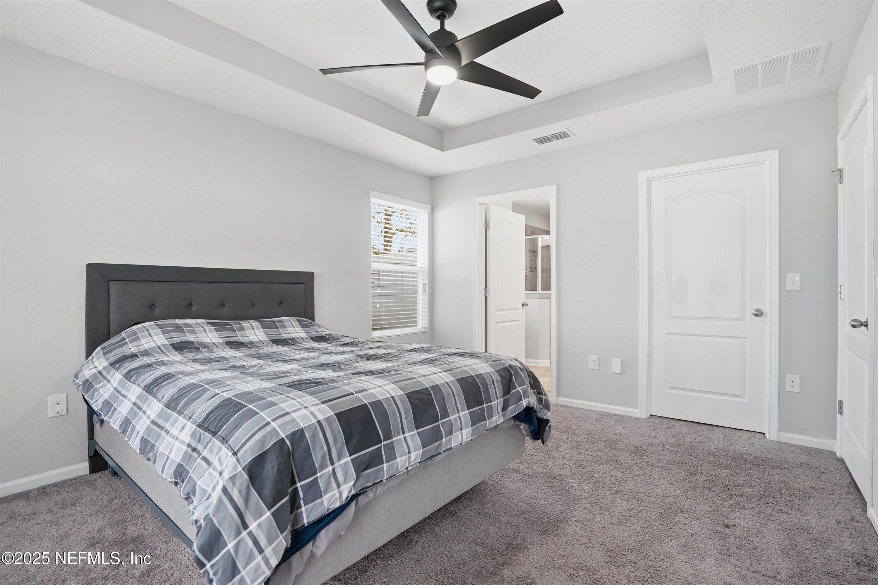 3994 Great Falls Loop Middleburg, FL 32068 - Photo 15 of 30 a spacious bedroom with a bed and window