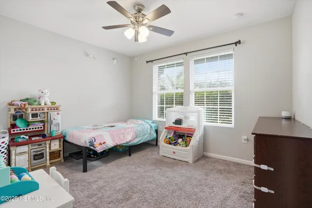 a bed room with a bed and a window