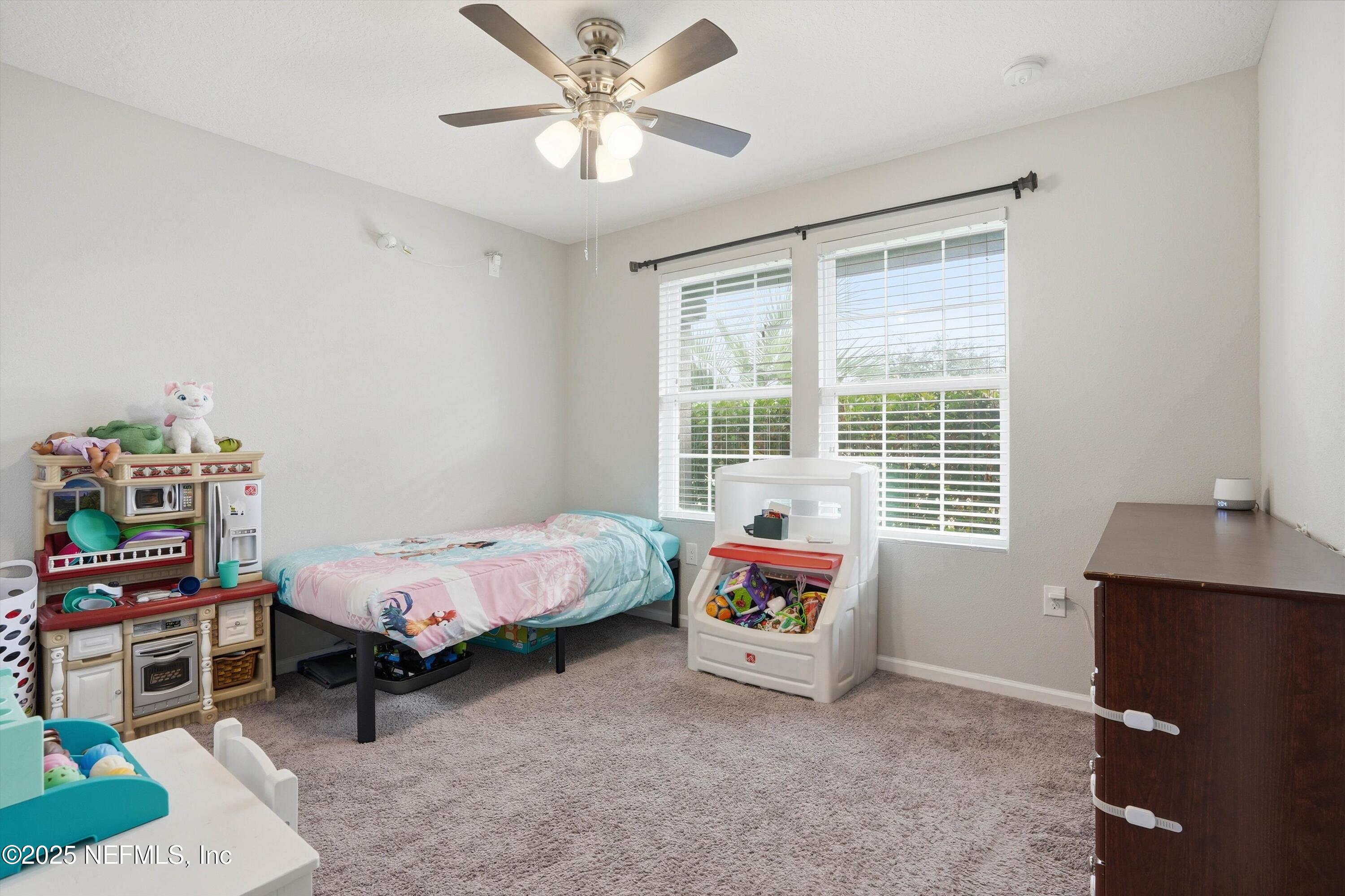3994 Great Falls Loop Middleburg, FL 32068 - Photo 19 of 30 a bed room with a bed and a window