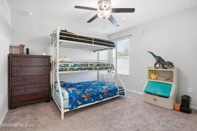 a bedroom with a bed and a tv